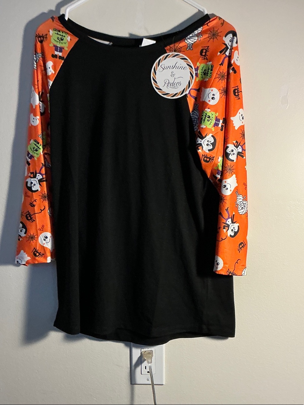 Kids Black Long-Sleeve Raglan Top with Orange Halloween Print Sleeves